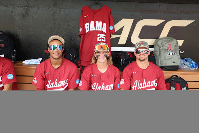 Alabama's Andrew Pinckney (21), Jim Jarvis (10), and Tommy Seidl (20) smiles for picture at David F. Couch Ballpark in Winston-Salem, N.C. on Sunday, June 11, 2023.